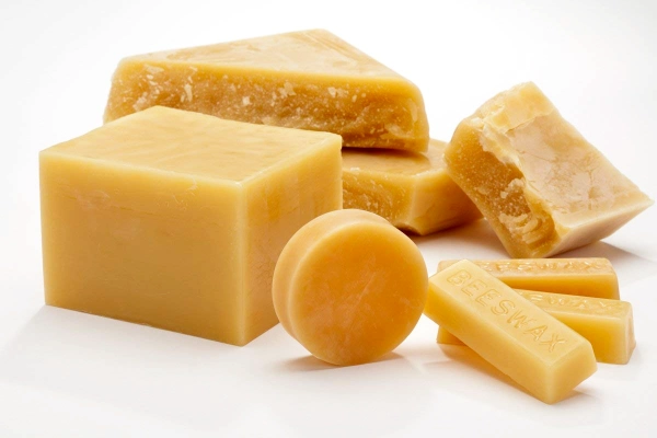 bees wax Various blocks and bars of golden-yellow beeswax, used by some beaders as a thread conditioner to prevent tangling.